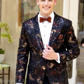 A young man clutches the lapel of his floral metallic 'Ryan' Dinner Jacket